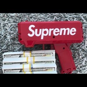 Supreme logoed Money gun with money bundle